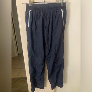 GAP windbreaker blue pants with white side zippers. Size XS
